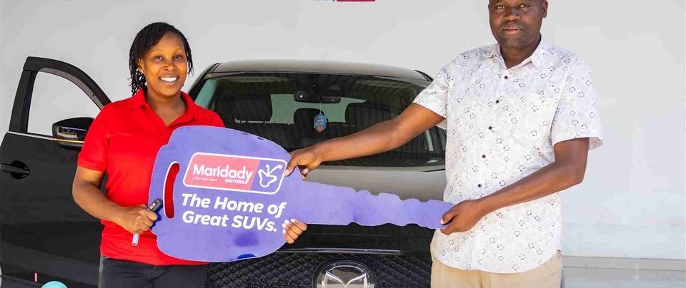 A new owner receiving her 2018 Mazda CX-5